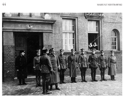 An inspection by the commander of the Polish Armed Forces of the Former Prussian Partition, General Józef Dowbor--Muśnicki at the airport in Ławica (March 1919). With his back to the camera and wearing boots with spurs, there is the Greater Poland Air Force Inspector, Colonel Pilot Gustaw Macewicz, and next to him: General Dowbor-Muśnicki. The officers of the Air Base are standing in a line: from the left - Second Lieutenant Pilot Jerzy Dziembowski, unknown, Second Lieutenant Pilot Wiktor Pniewski, Second Lieutenant Pilot Edmund Norwid-Kudło, Second Lieutenant Pilot Józef Mańczak, unknown, Second Lieutenant Pilot Wojciech Biały and military official Hullej. Photo from the collection of Priest R. Kulczyński SDB